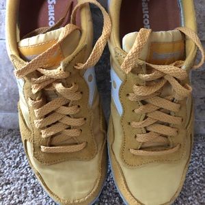 Yellow Saucony tennis shoes